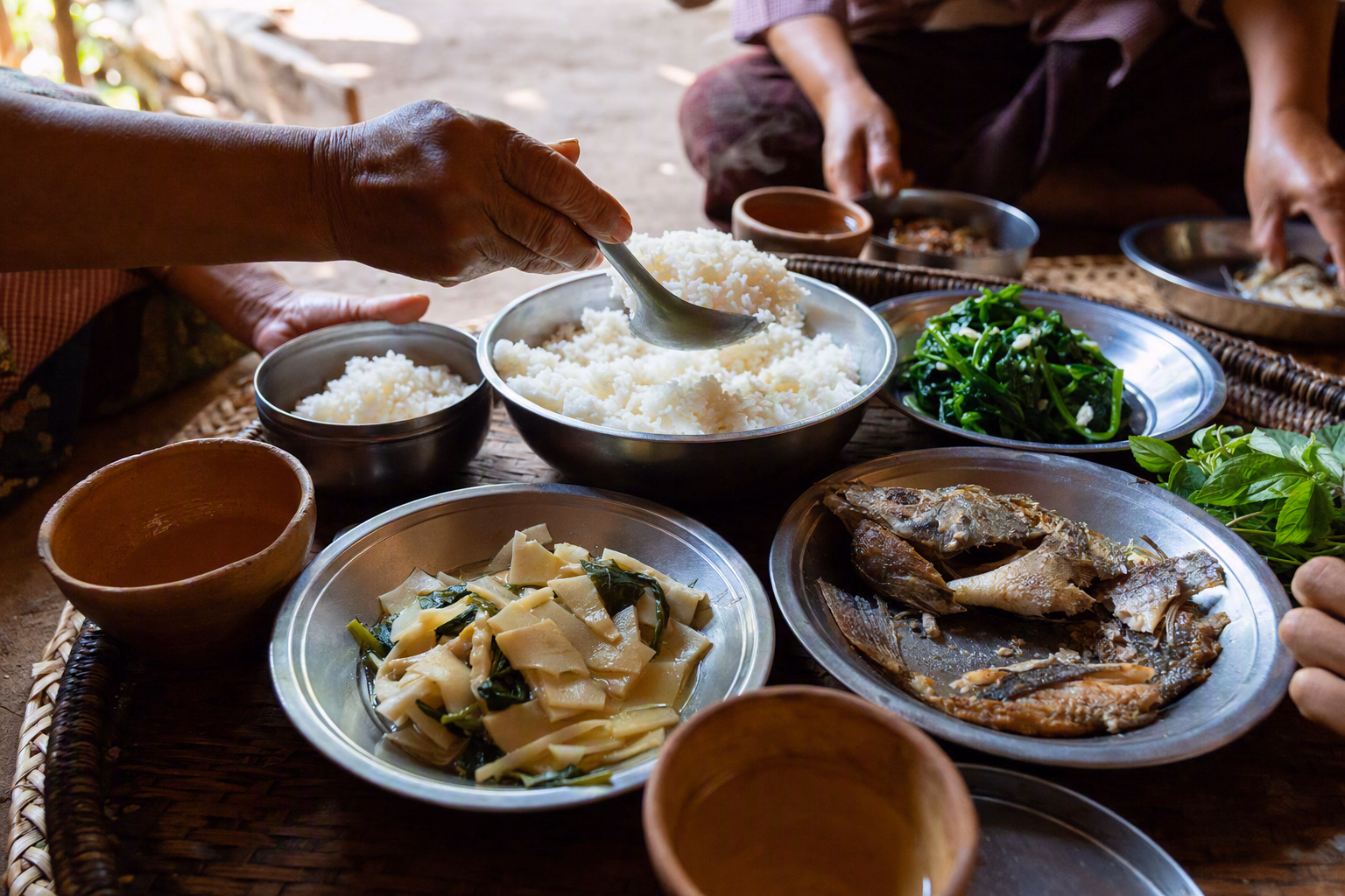 Editorial tabletop composition of rice, vegetables, herbs and hill-region food ingredients