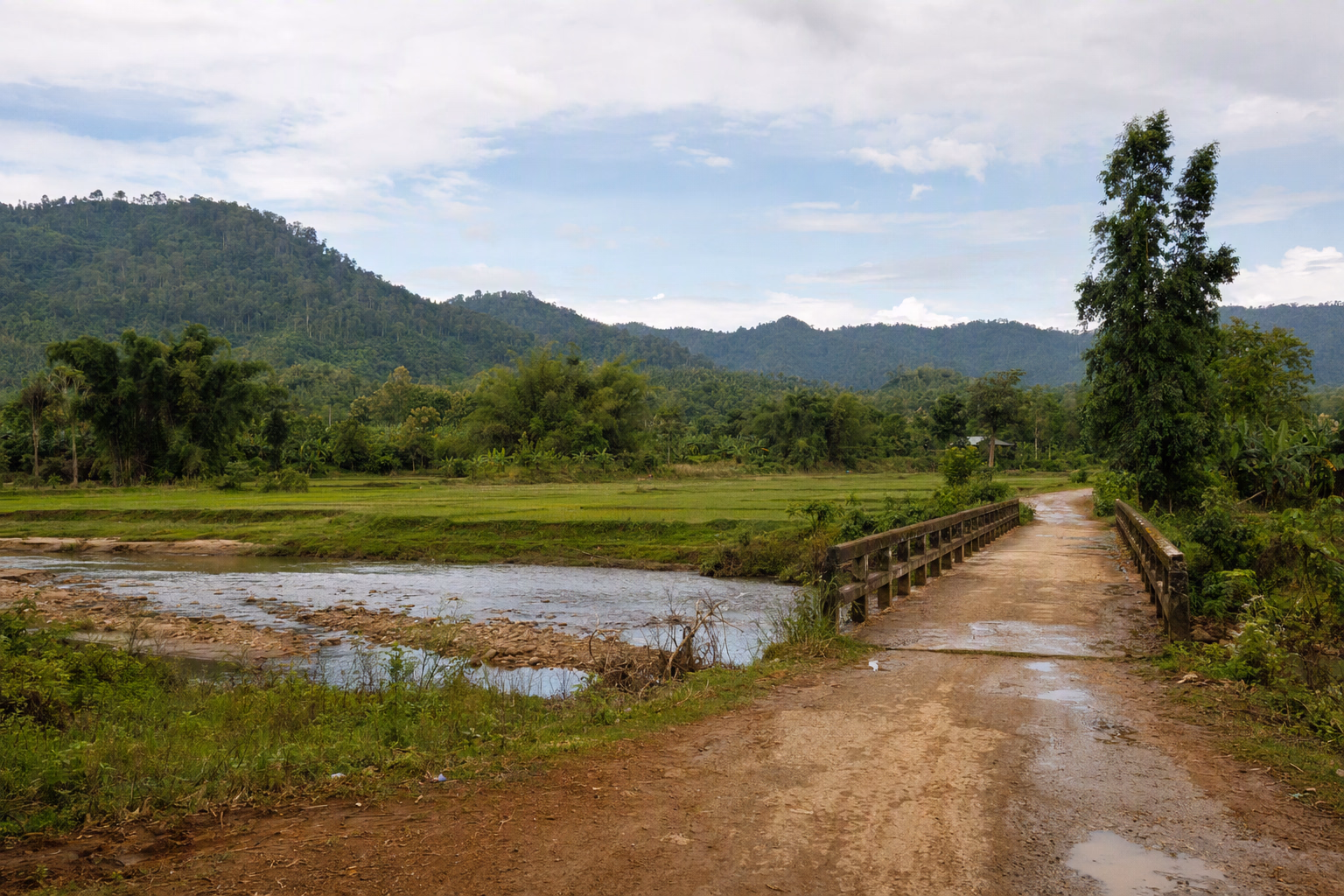 Editorial travel artwork of layered hills and a route through the Dighinala area